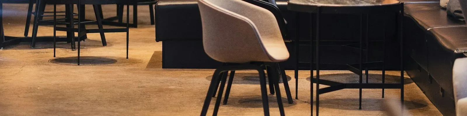 The inside of a café, tables and chairs